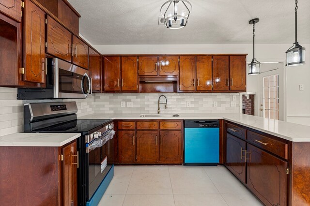 4658 Thoroughbred Ln, Columbus, GA 31909 - kitchen featuring appliances with stainless steel finishes, a sink, a peninsula, tasteful backsplash, and light countertops