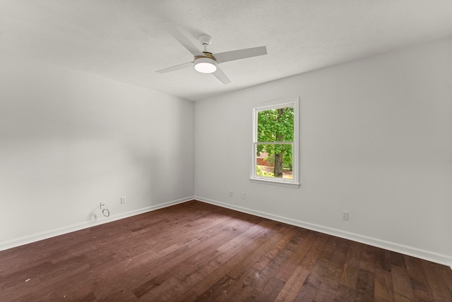 4658 Thoroughbred Ln, Columbus, GA 31909 - empty room featuring dark wood-style floors, ceiling fan, and baseboards