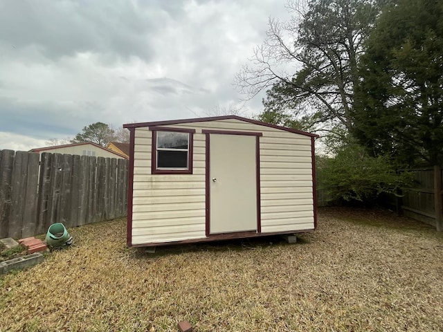 view of shed with a fenced backyard