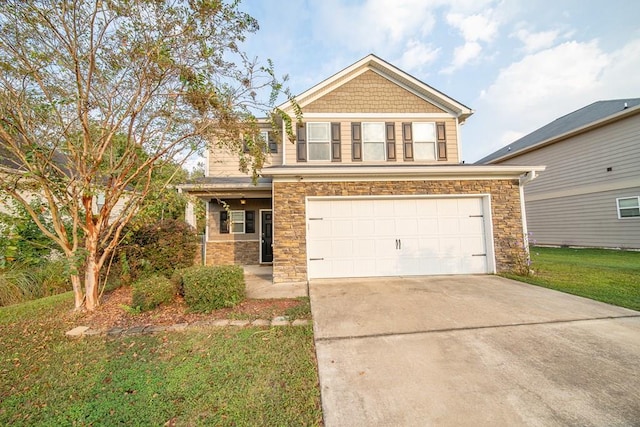 view of front facade with a front yard and a garage