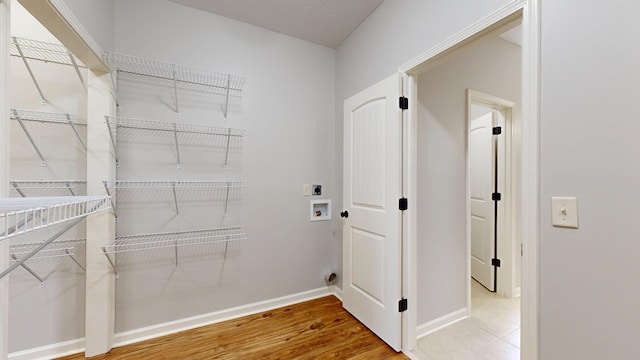 7315 San Vista Dr, Columbus, GA 31909 - laundry room featuring hookup for an electric dryer, baseboards, hookup for a washing machine, and wood finished floors