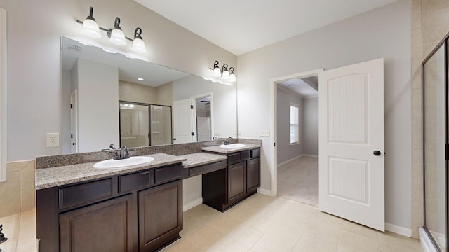 7315 San Vista Dr, Columbus, GA 31909 - full bathroom featuring a shower stall, double vanity, baseboards, and tile patterned floors