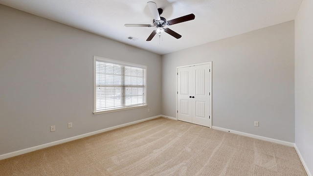 7315 San Vista Dr, Columbus, GA 31909 - unfurnished bedroom with light carpet, baseboards, a closet, and ceiling fan