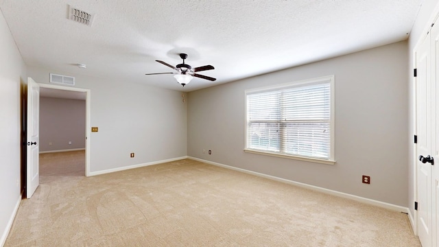 7315 San Vista Dr, Columbus, GA 31909 - empty room with light colored carpet, ceiling fan, baseboards, and a textured ceiling