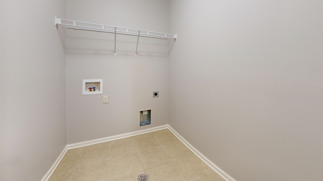 7315 San Vista Dr, Columbus, GA 31909 - laundry area with electric dryer hookup, washer hookup, baseboards, and light tile patterned floors