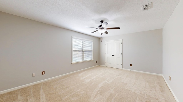 7315 San Vista Dr, Columbus, GA 31909 - spare room featuring ceiling fan, light carpet, baseboards, and a textured ceiling