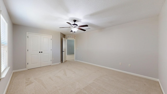 7315 San Vista Dr, Columbus, GA 31909 - unfurnished bedroom with light carpet, multiple windows, a closet, and baseboards