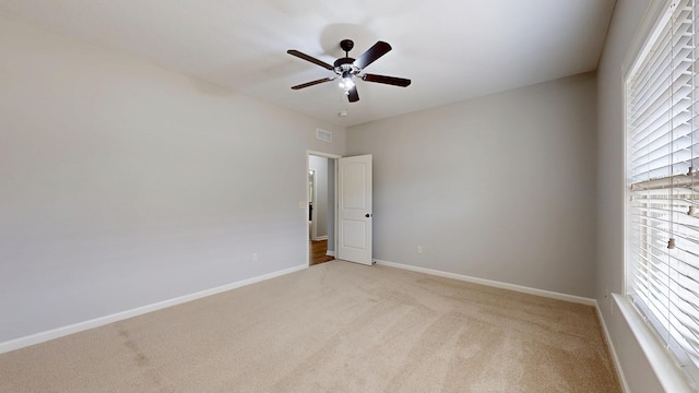 7315 San Vista Dr, Columbus, GA 31909 - empty room with light colored carpet, a ceiling fan, and baseboards