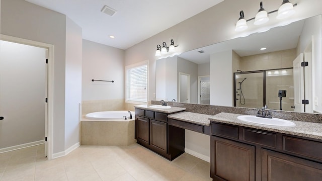 7315 San Vista Dr, Columbus, GA 31909 - bathroom featuring double vanity, a stall shower, a bath, tile patterned flooring, and baseboards