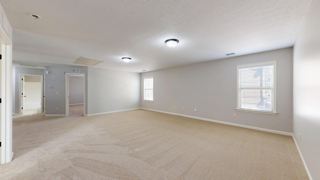 7315 San Vista Dr, Columbus, GA 31909 - empty room featuring attic access, light colored carpet, baseboards, and a textured ceiling