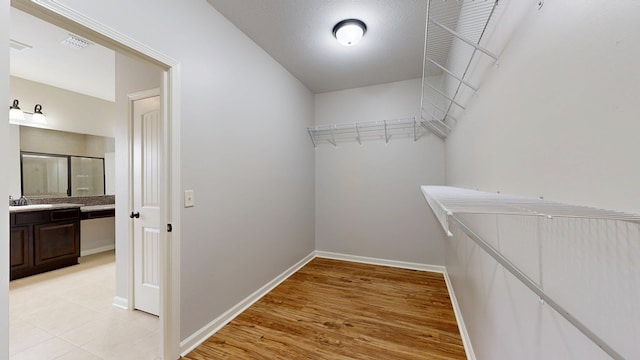 7315 San Vista Dr, Columbus, GA 31909 - walk in closet featuring light wood-type flooring and a sink