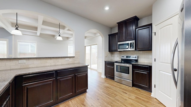 7315 San Vista Dr, Columbus, GA 31909 - kitchen with stainless steel appliances, light wood finished floors, decorative backsplash, recessed lighting, and beamed ceiling