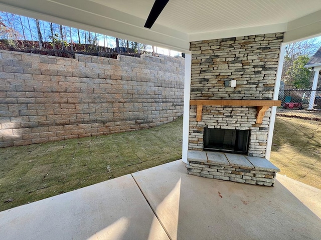 view of patio / terrace with an outdoor stone fireplace