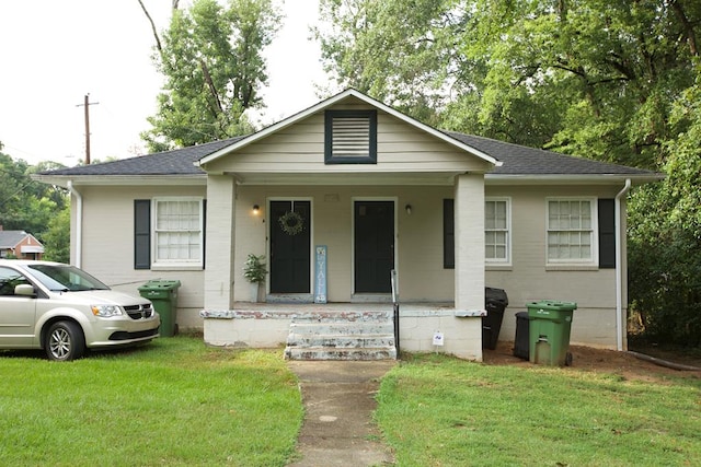 view of front of house with a porch and a front yard