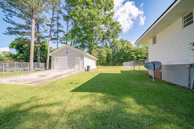 35 Dogwood St, West Point, GA 31833 - view of yard featuring a garage, concrete driveway, and an outbuilding