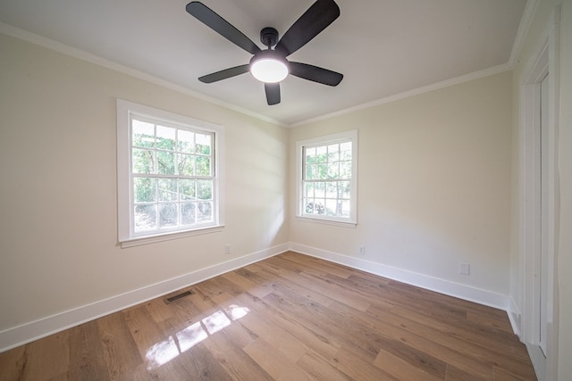 35 Dogwood St, West Point, GA 31833 - empty room featuring wood finished floors, baseboards, ornamental molding, and a ceiling fan