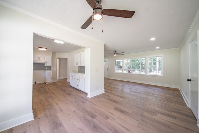 35 Dogwood St, West Point, GA 31833 - unfurnished living room with crown molding, ceiling fan, baseboards, light wood-style flooring, and recessed lighting