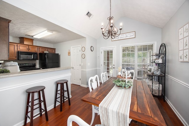 6 Lincolnshire Ln, Phenix City, AL 36870 - dining area featuring a chandelier, dark wood finished floors, lofted ceiling, and baseboards