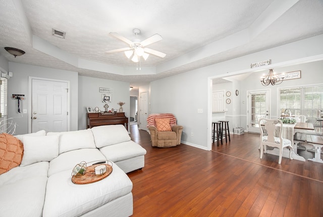 6 Lincolnshire Ln, Phenix City, AL 36870 - living area with a raised ceiling, ceiling fan, wood finished floors, a chandelier, and baseboards
