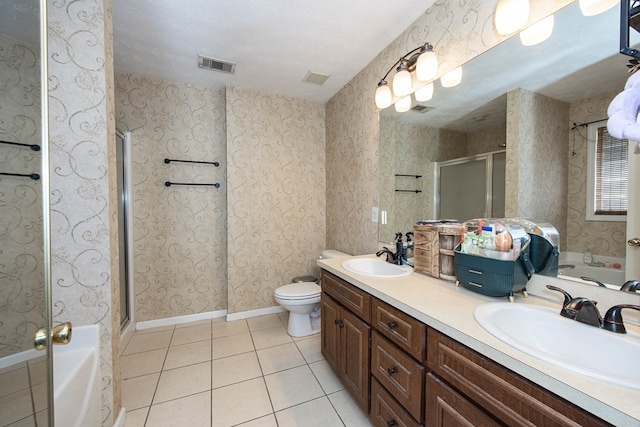 6 Lincolnshire Ln, Phenix City, AL 36870 - full bathroom with tile patterned floors, a garden tub, double vanity, and a shower stall