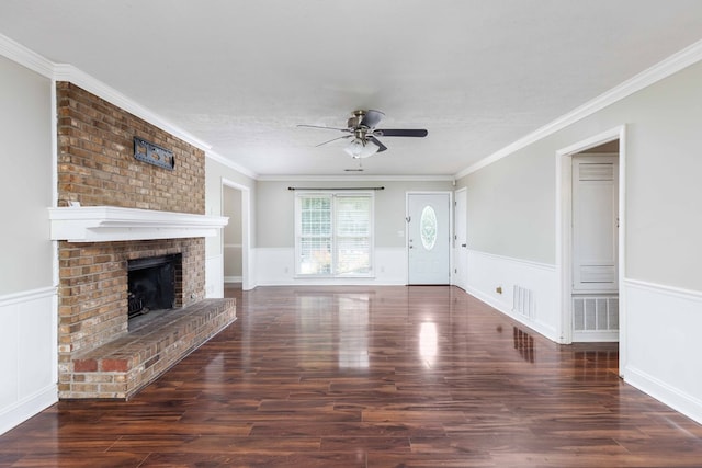 4 David Ct, Columbus, GA 31909 - unfurnished living room featuring ceiling fan, a wainscoted wall, wood finished floors, ornamental molding, and a fireplace