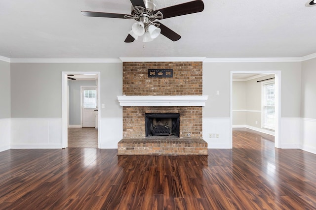 4 David Ct, Columbus, GA 31909 - unfurnished living room featuring a wainscoted wall, ceiling fan, wood finished floors, a fireplace, and crown molding