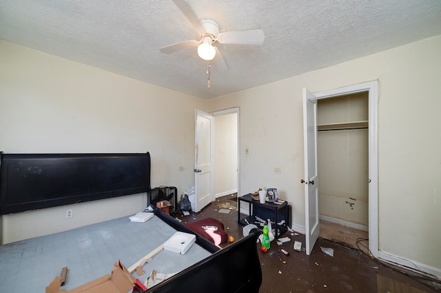 home office with ceiling fan and a textured ceiling