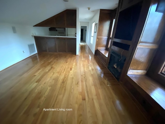 unfurnished living room with light hardwood / wood-style flooring