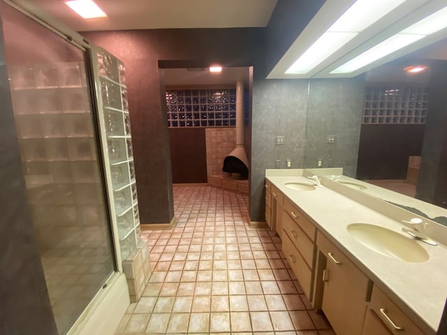 bathroom with tile patterned flooring and vanity