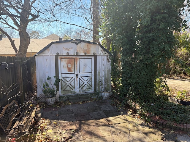 view of shed with fence