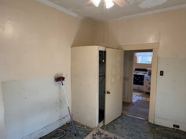 empty room with ornamental molding and a ceiling fan