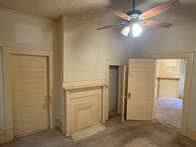 spare room with a ceiling fan, a textured ceiling, and unfinished concrete floors