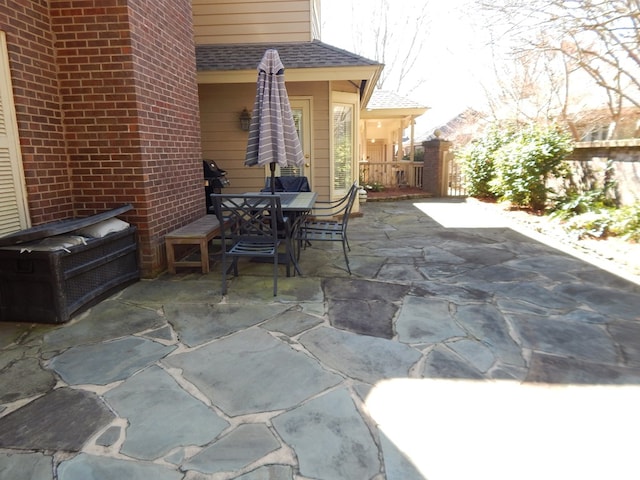 view of patio with outdoor dining space and a grill