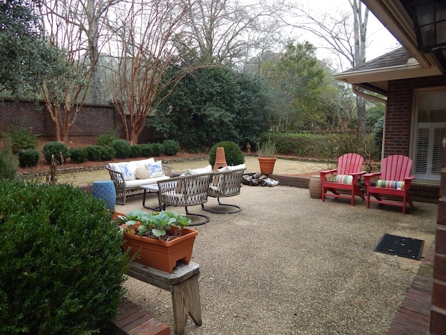 view of patio / terrace featuring fence and an outdoor hangout area