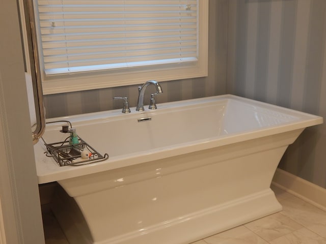 full bathroom with a freestanding bath