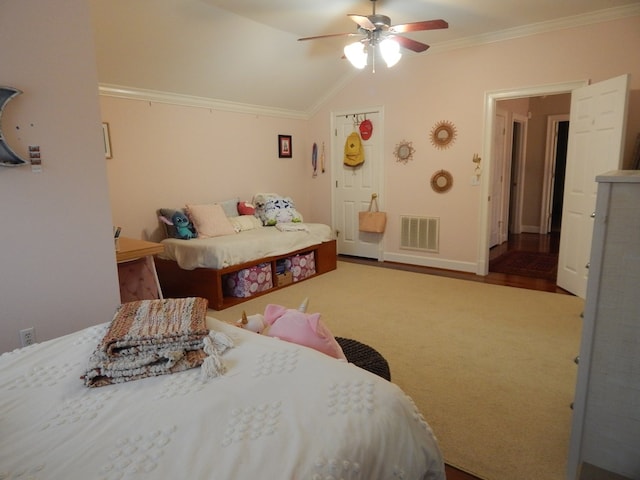 bedroom featuring baseboards, visible vents, ceiling fan, vaulted ceiling, and crown molding