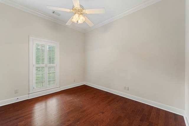 empty room with ornamental molding, dark wood-type flooring, and ceiling fan