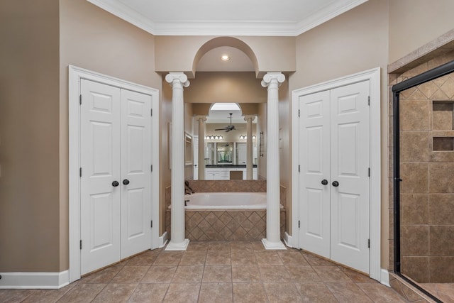 bathroom with ornamental molding, a closet, a stall shower, and ornate columns