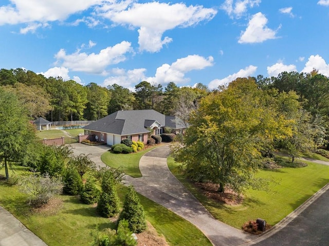 drone / aerial view featuring a view of trees