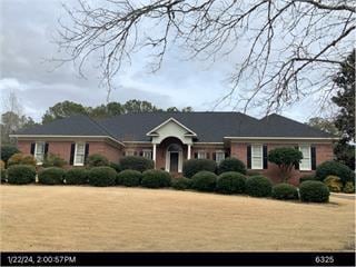 ranch-style house with a front yard