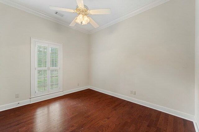 unfurnished bedroom with ornamental molding, dark wood-type flooring, ceiling fan, and a closet