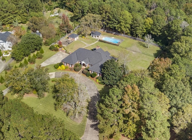 aerial view featuring a wooded view