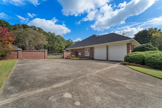 view of side of home featuring a garage