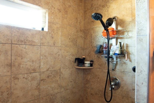 details featuring a tile shower