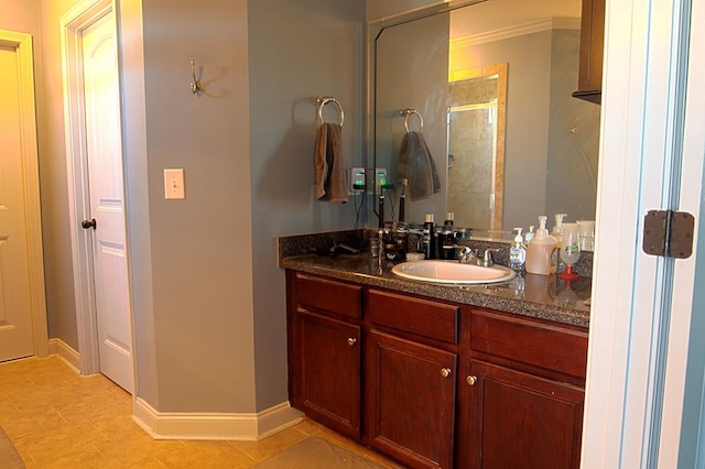 bathroom featuring walk in shower, tile patterned floors, and vanity