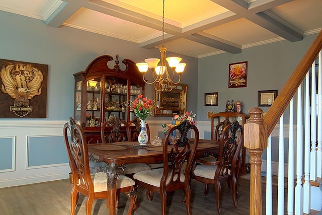 dining room with beamed ceiling, coffered ceiling, crown molding, dark wood-type flooring, and an inviting chandelier