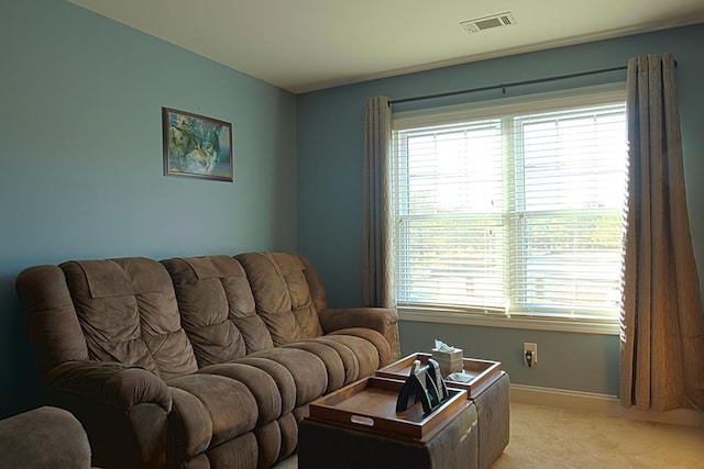 living room featuring light carpet