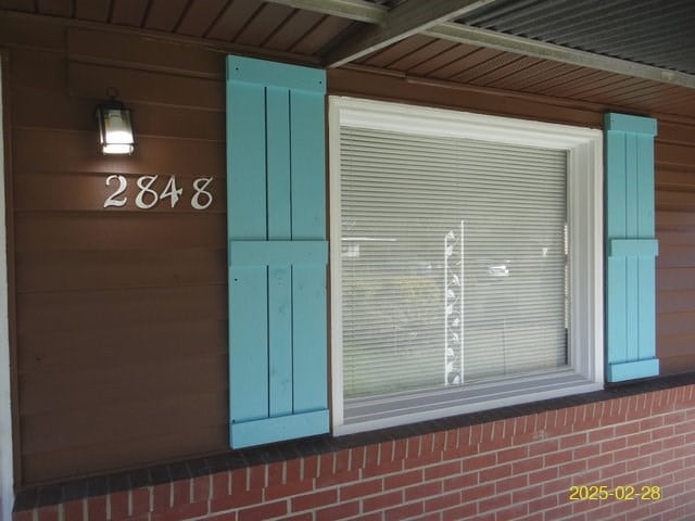 exterior space featuring brick siding