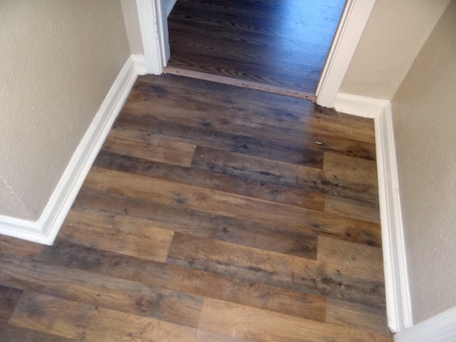 details with wood finished floors and baseboards