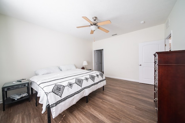 bedroom with ceiling fan and dark wood-type flooring